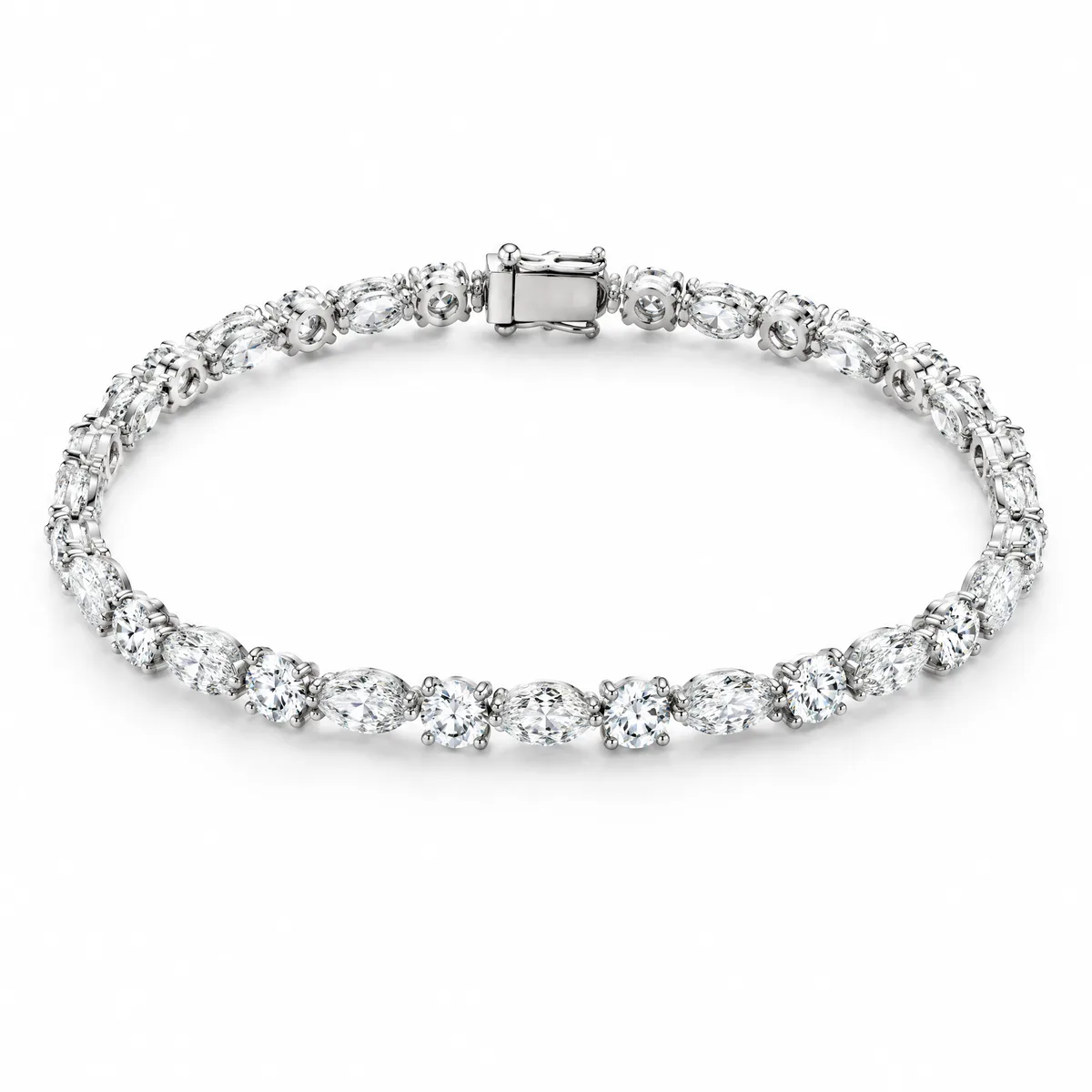 Marquise and round tennis bracelet: Alternating marquise and round brilliant diamonds in 18k white gold claws